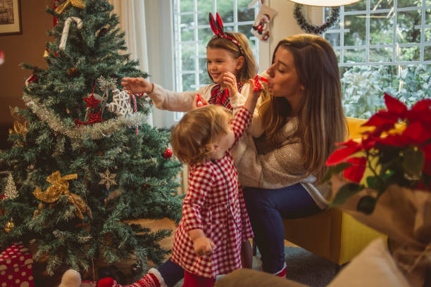istock mother and her daughters enjoying Christmas 1082001586