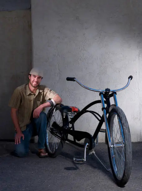 30 year old male posing with his low rider bicycle