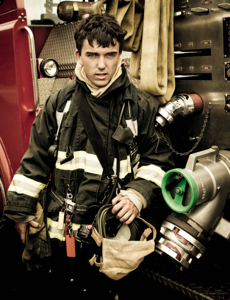 istock Firefighter by the truck 108200429