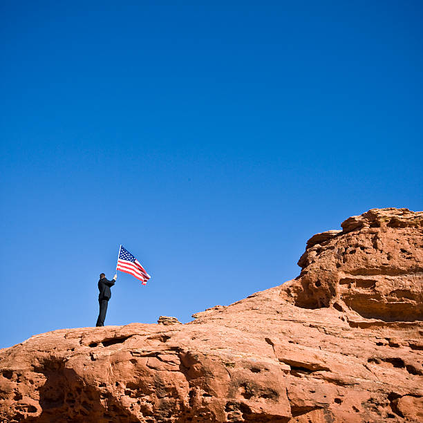 istock Businessman holding American Flag 108200433
