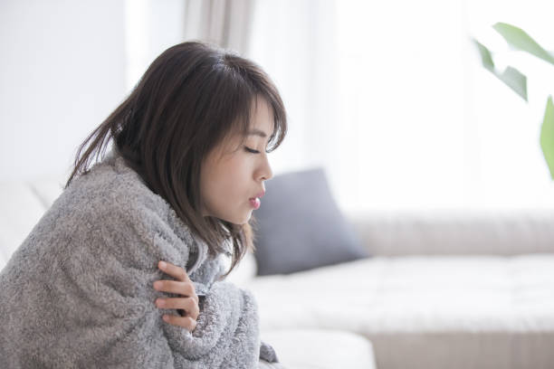 woman sick and feel cold woman sick and feel cold at home cold temperature stock pictures, royalty-free photos & images