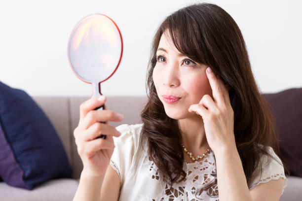 istock Middle woman looking in the mirror 1082005490