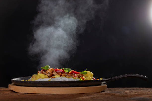 steaming hot sizzler on wood