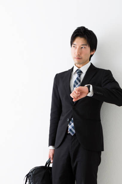 istock Young businessman watching the clock 1082005950