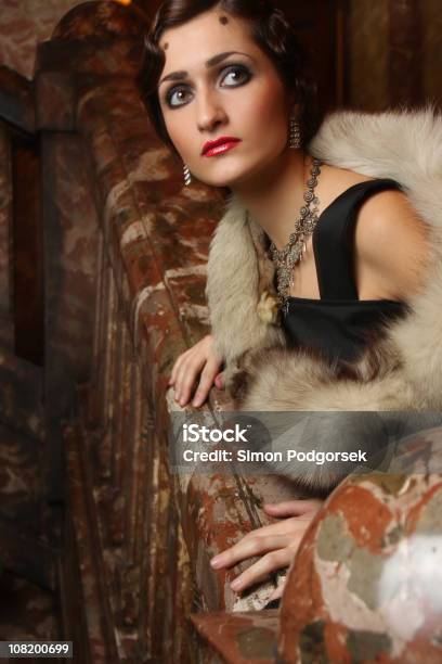 Vintage Woman Looking Over Railing Of Staircase Stock Photo - Download Image Now - Anxiety, High Society, Worried