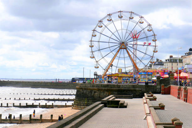 Bridlington, Yorkshire, UK. April 29, 2018. Holidaymakers enjoying the sands and funfair on the seafront at Bridlington in Yorkshire, UK.