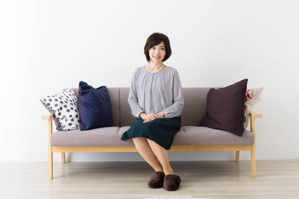 istock Middle woman sitting on the couch 1082008520