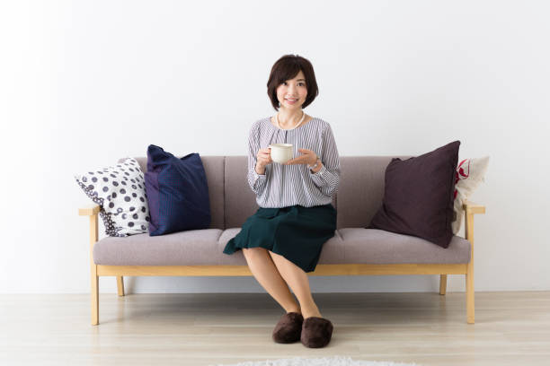 istock Middle woman sitting on the couch 1082008524