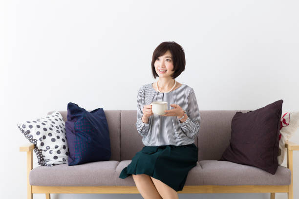 istock Middle woman sitting on the couch 1082008528