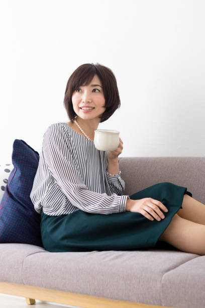 istock Middle woman sitting on the couch 1082008542