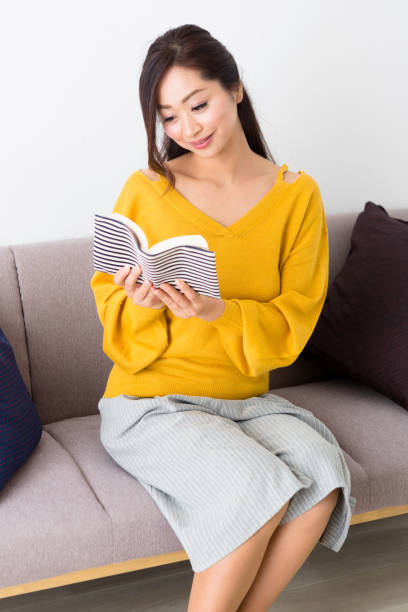 istock Middle woman sitting on the couch 1082008860