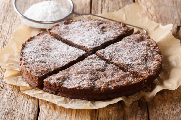 home-made fresh swedish dessert: kladdkaka chocolate sticky cake with powdered sugar close-up. horizontal - food vegan food gourmet vegetarian food imagens e fotografias de stock