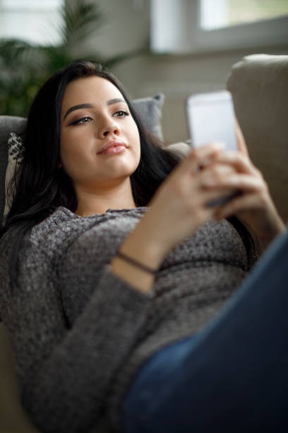 istock Young woman enjoying a relaxing weekend at home 1082011232