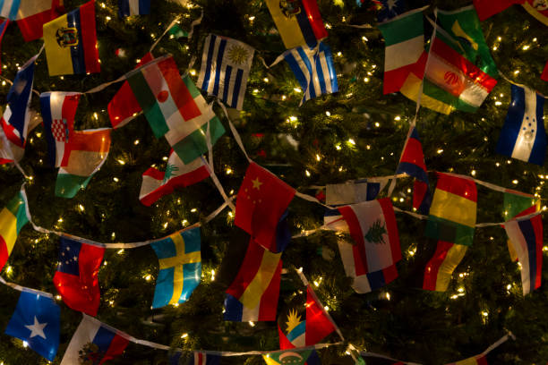 Christas Tree Decorated with Variety Countries Flags, Wishing World United and Peace Christas Tree Decorated with Variety Countries Flags, Wishing World United and Peace in Details hondurian flag stock pictures, royalty-free photos & images