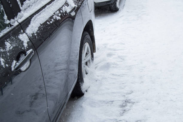 istock The car is on a winter road, side view 1082011402