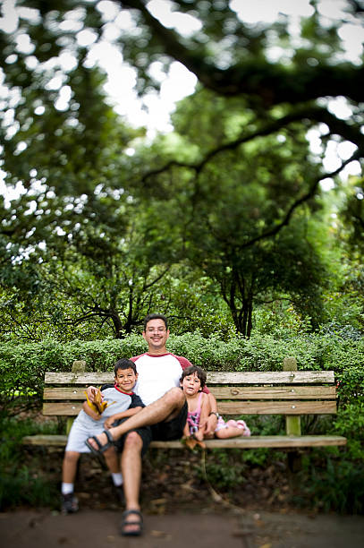 istock Children with Father Outside at Park 108201368