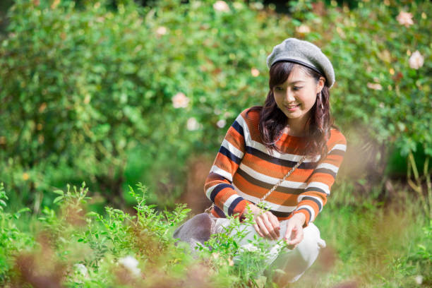 istock A woman walking in the park 1082013946