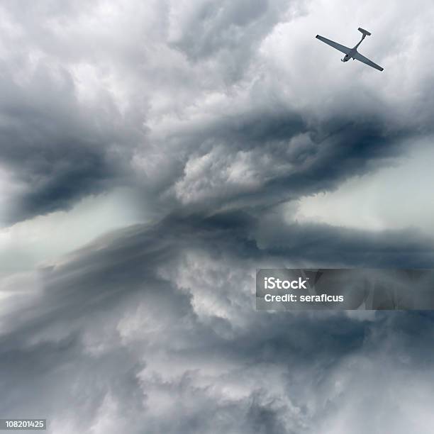 Airplane In The Storm Stock Photo - Download Image Now - Air Vehicle, Airplane, Cloud - Sky