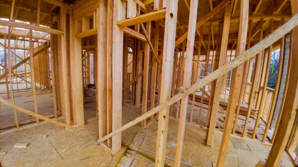 Residential construction home framing view on new house wooden under construction