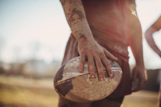 istock Rugby player standing on a playing field with ball 1082014958