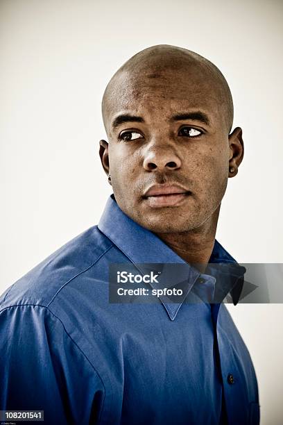 Young Man Stock Photo - Download Image Now - Looking Over Shoulder, Serious, 20-29 Years