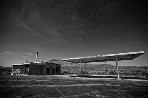 abandoned petrol station in the desert village of Desert Center in sunset