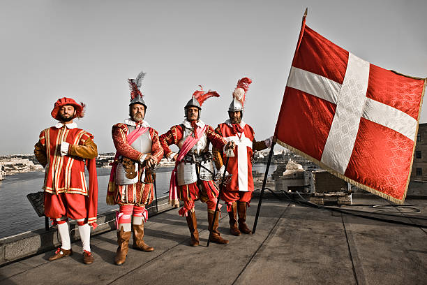 The Knights of Malta Knights of Malta on the top of Fort Sant Elmo at Sunset with Maltese Flag, Valetta, Malta. Knights Group Portrait. Personal Editing knight person photos stock pictures, royalty-free photos & images