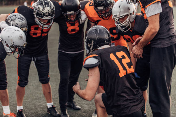 istock Football Players Huddling 1082016204
