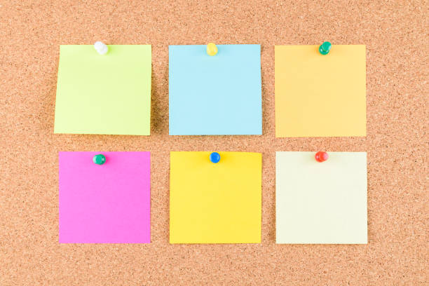 istock Colorful sticky note on brown cork board with colorful tack pin or Thumbtack or pushpin 1082017348