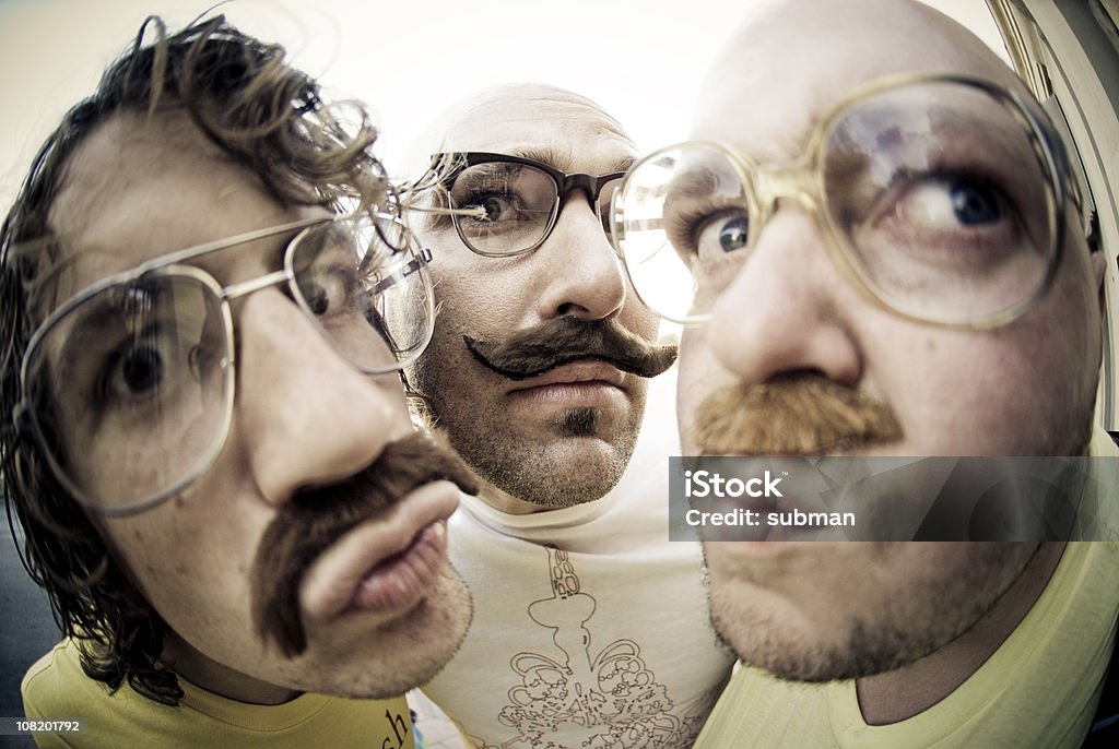 Three men staring  Fish-Eye Lens Stock Photo