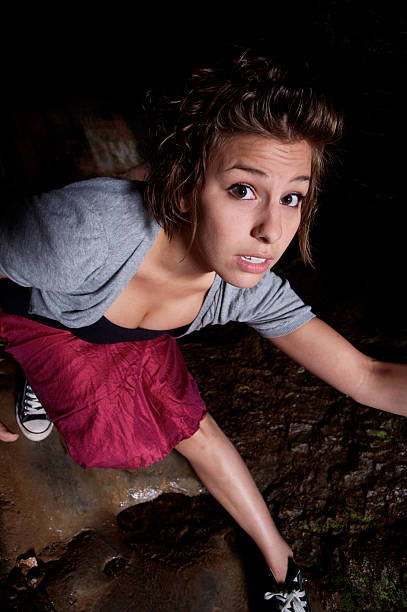 istock Young Woman Walking Through Caves 108201879