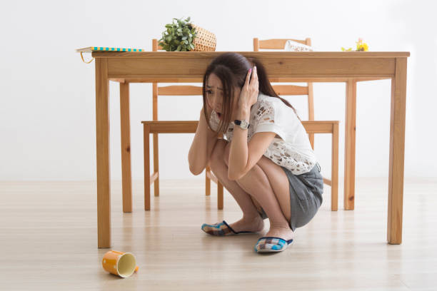 istock A woman displaced under the table by an earthquake 1082020212
