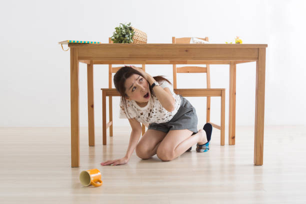 istock A woman displaced under the table by an earthquake 1082020306