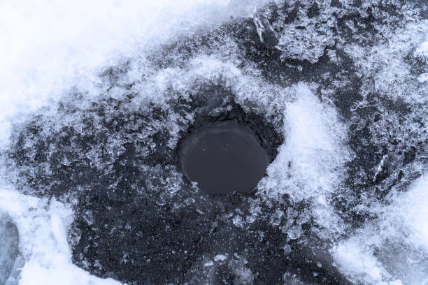 istock Ice hole for winter fishing 1082021430
