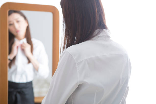 istock Woman looking in the mirror 1082021450
