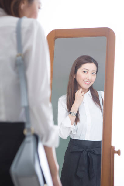 istock Woman looking in the mirror 1082021456