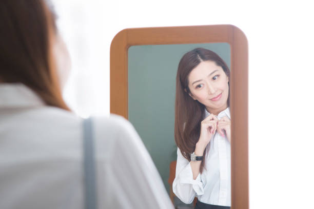 istock Woman looking in the mirror 1082021466