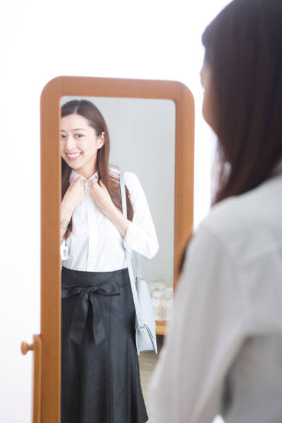 istock Woman looking in the mirror 1082021488