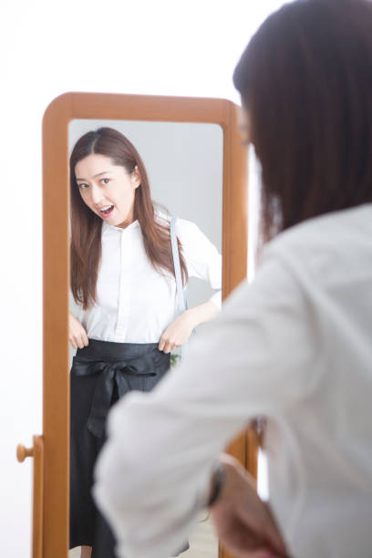 istock Woman looking in the mirror 1082021500