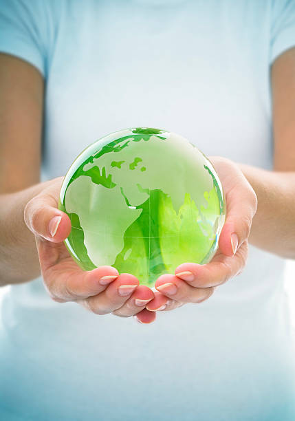 istock Young Woman Holding Green Transparent Globe 108202350