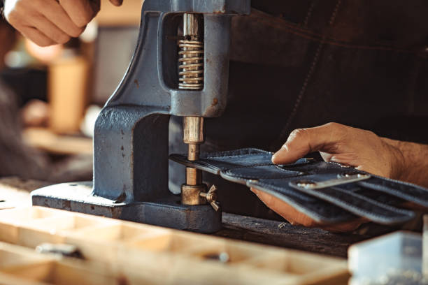 the master works with the Vice Man works in carpentry workshop. He fixes wooden handle in vice. Different tools are on workbench. Men at work. Hand work. riveting stock pictures, royalty-free photos & images
