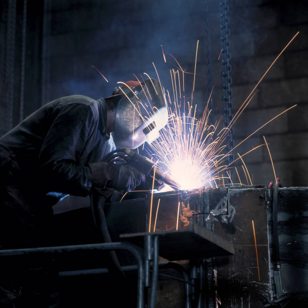 istock Man Welding in Industrial Warehouse 108202405