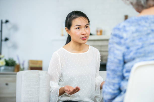 istock Woman speaking to therapist 1082024744