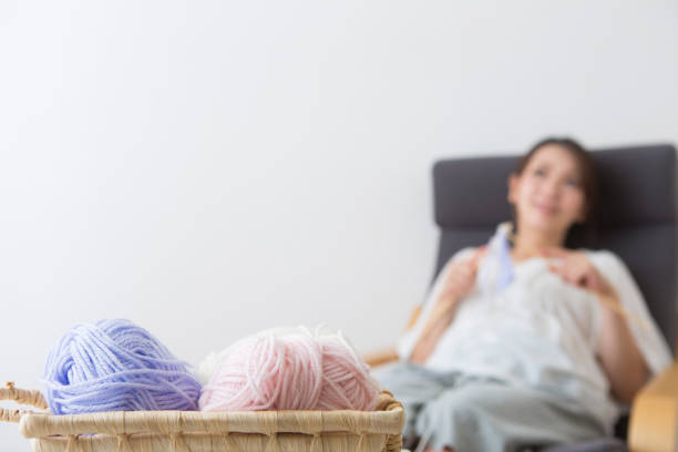 Pregnant woman knitting