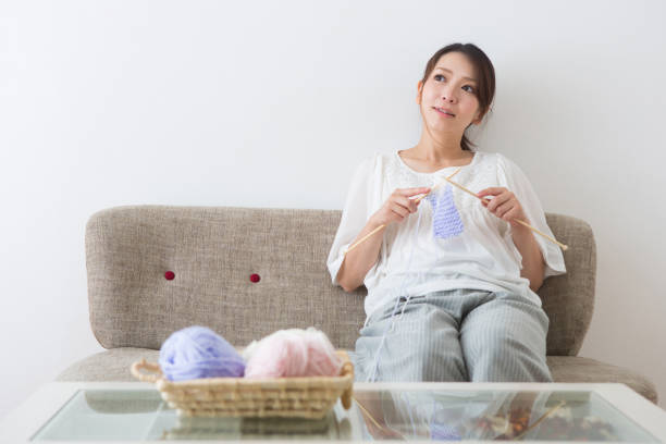 istock Pregnant woman knitting 1082025192