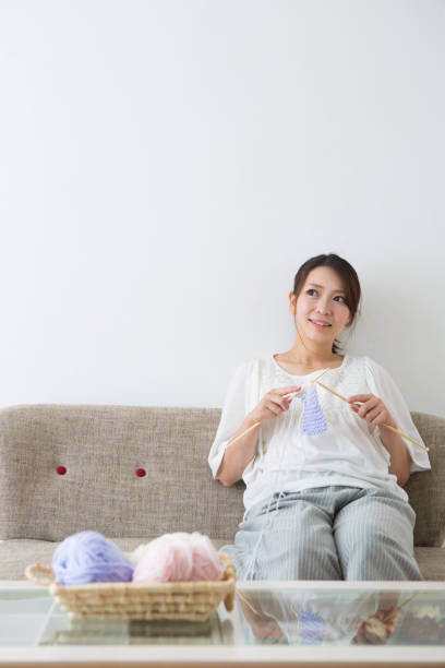 istock Pregnant woman knitting 1082025206