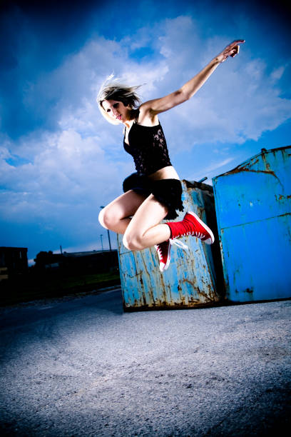 istock Young Woman Jumping High in Air 108202671