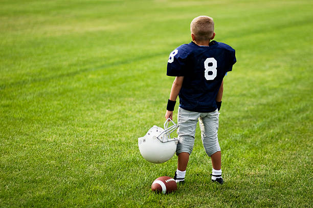 200+ Kid In Football Uniform Stock Photos, Pictures & Royalty-Free Images -  iStock