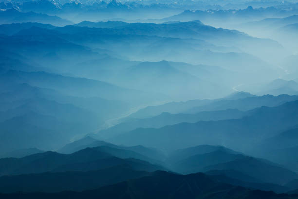 Himalaya Mountains Covered in Mist and Fog stock photo