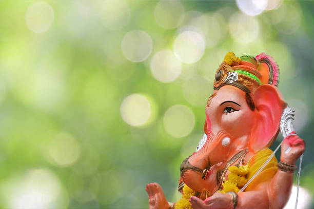 Bokeh Ganesh Ganesh idol captured during visarjan. Can be an amazing background picture for any kind of text input. Ganapati Bappa Maurya ganesh chaturthi photos stock pictures, royalty-free photos & images